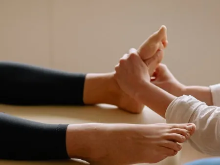 practitioner performing foot zoning reflexology